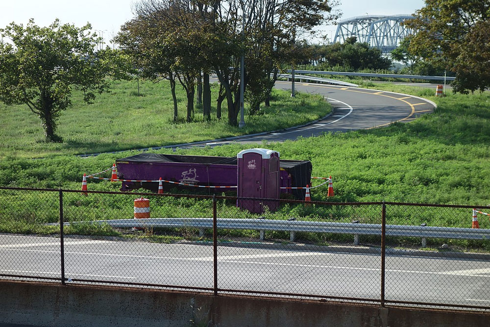 Dumpster and portable toilet at work